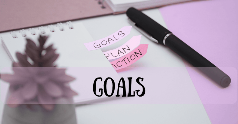 Goals planning workspace with pink sticky notes reading 'GOALS', 'PLAN', 'ACTION' on notebook with pen and succulent plant